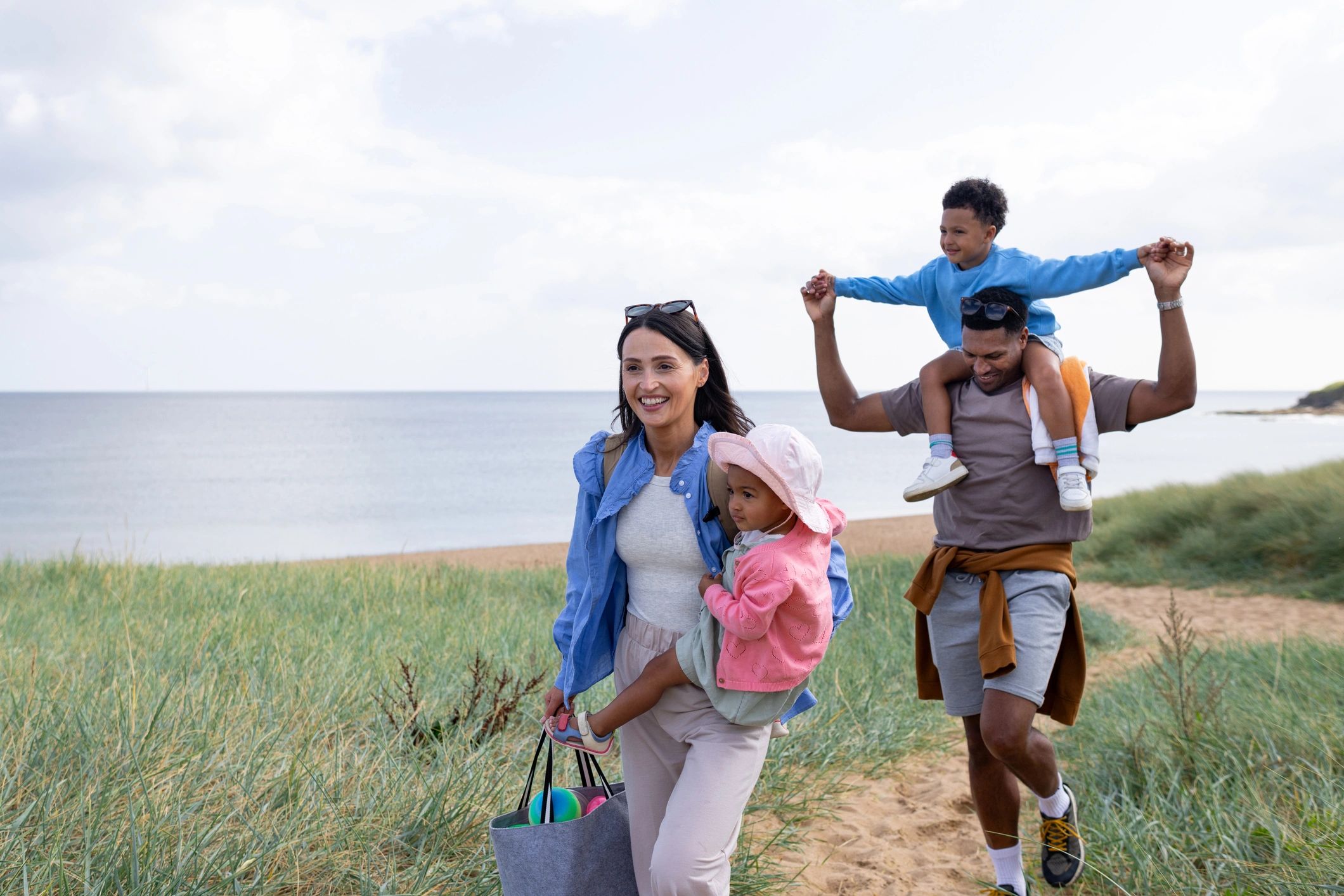 Family walking toward the beach representing family vacation planning