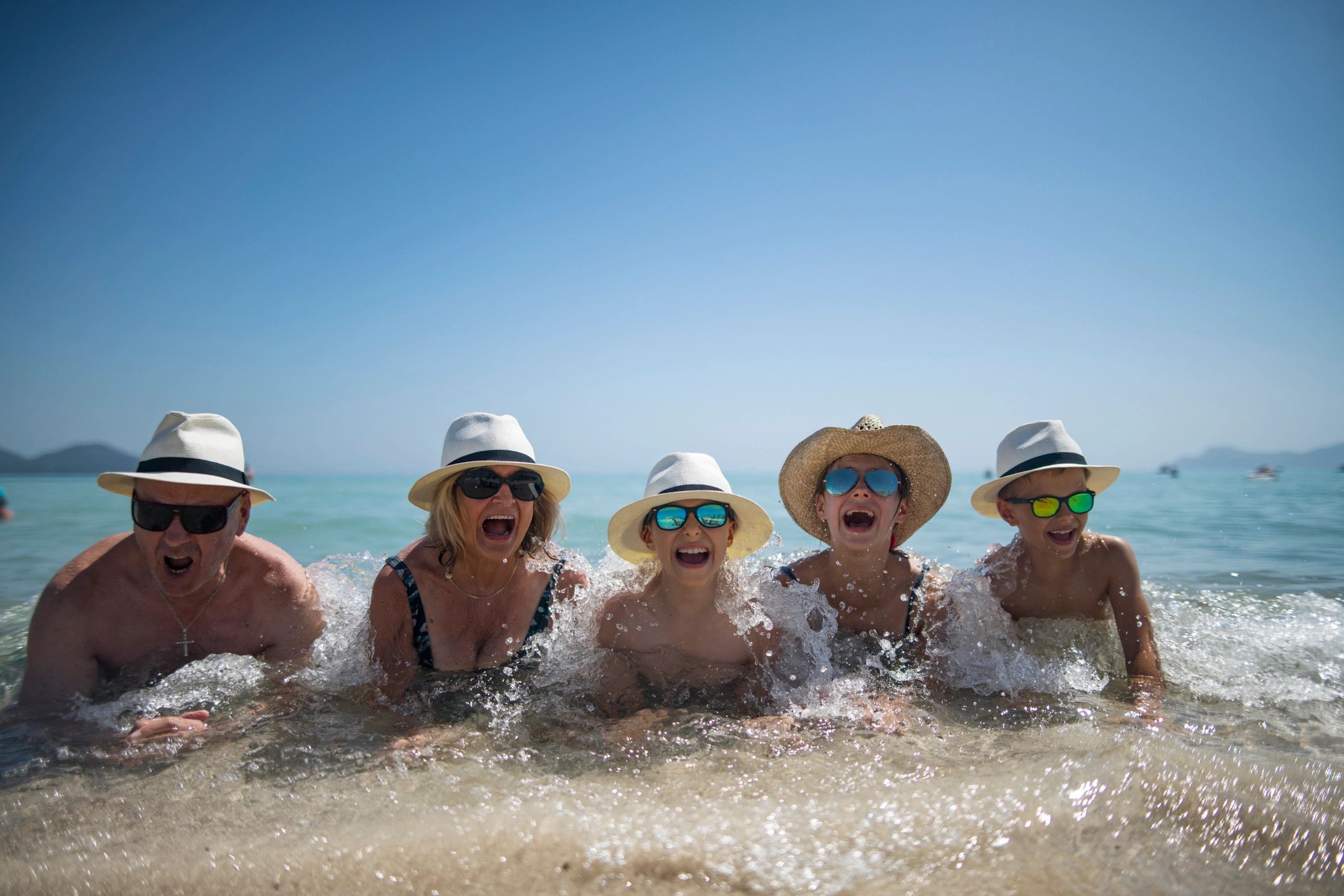 Multi-age family having fun together at the beach